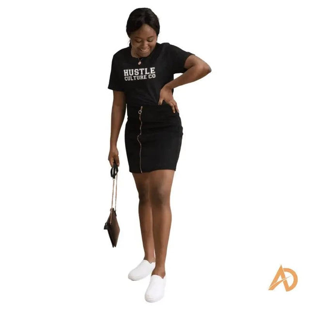 Woman wearing Hustle Culture Varsity T-shirt made of ring-spun cotton in black