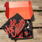 Hustle Culture Box featuring a vibrant red and black design with color pencils