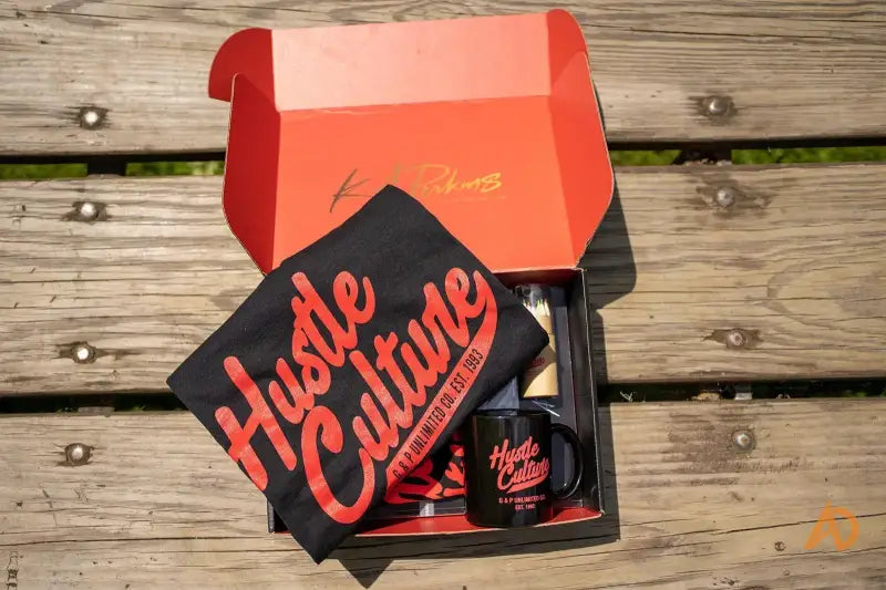 Hustle Culture Box featuring a vibrant red and black design with color pencils