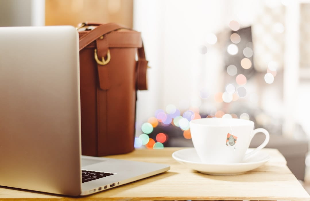 Silver laptop computer with black keyboard for stress management techniques article