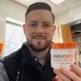 Elegant brown leather wallet with gold accents, embossed Avodah Dynamics logo for perfect morning routine.