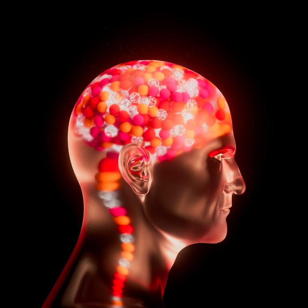Translucent human head model with colorful pills illustrating stress management techniques
