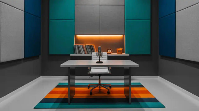 White office chair with black armrests and wheels, upholstered in fabric.